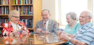Seniors Playing Cards together at Oak Park Arms Adult Day Care
