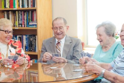 Seniors Playing Cards together at Oak Park Arms Adult Day Care